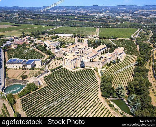 Aerial view of Monastery of Santa Maria de Poblet and surrounding fields in Poblet, Vimbodí, Tarragona, Catalonia, Spain.