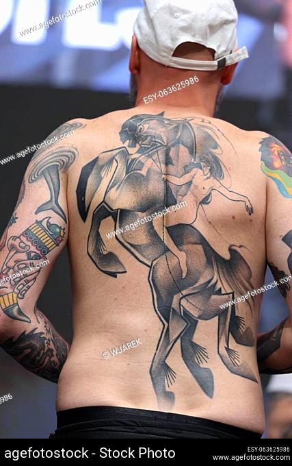 Krakow, Poland - June 11, 2022: Unidentified participant during the contest for the best tattoo at the 15th Tattoofest Convention in Cracow