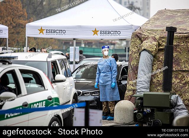 Military and army health workers while take a swab in the drive through area of Novara street car park , Milan, ITALY-13-11-2020