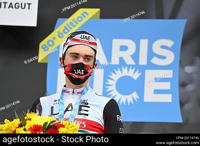 US Brandon McNulty of UAE Team Emirates celebrates on the podium after winning the fifth stage of 80th edition of the Paris-Nice cycling race