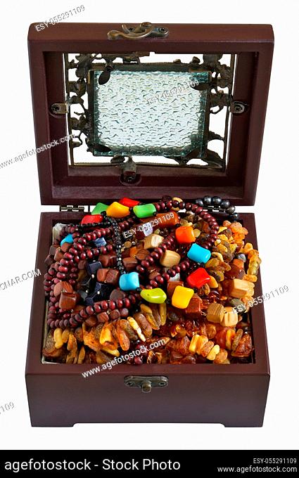 A young woman keeps her beads necklaces and bracelets in a dusty mass production box of mahogany. Isolated on white