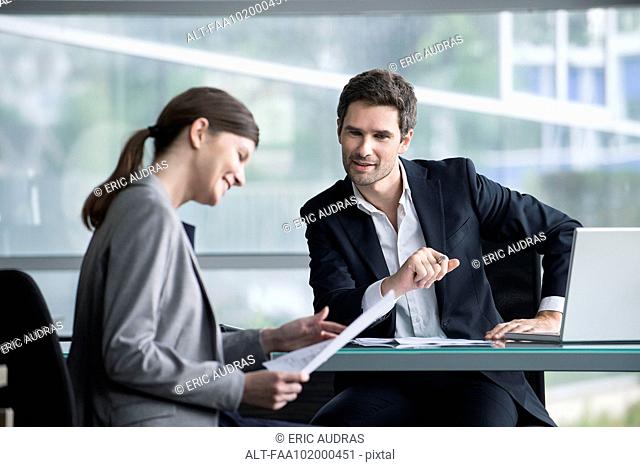 Financial advisor meeting with satisfied investor