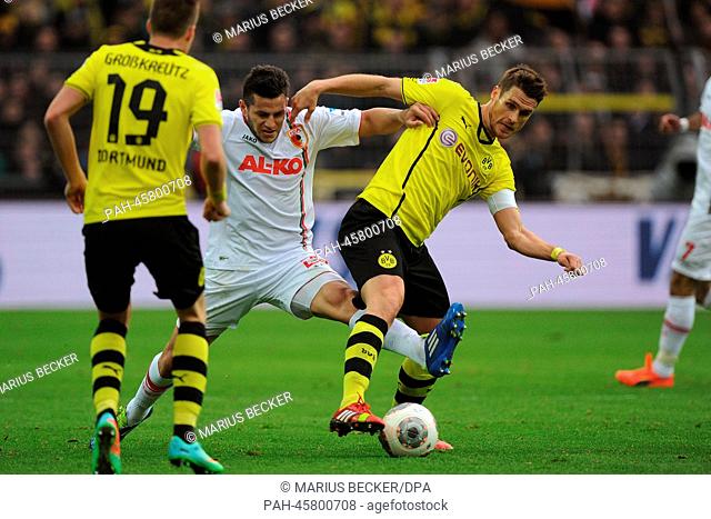 Dortmund's Sebastian Kehl (R) vies for the ball with Augsburg's Raul Bobadilla during the German Bundesliga soccer match between Borussia Dortmund and FC...
