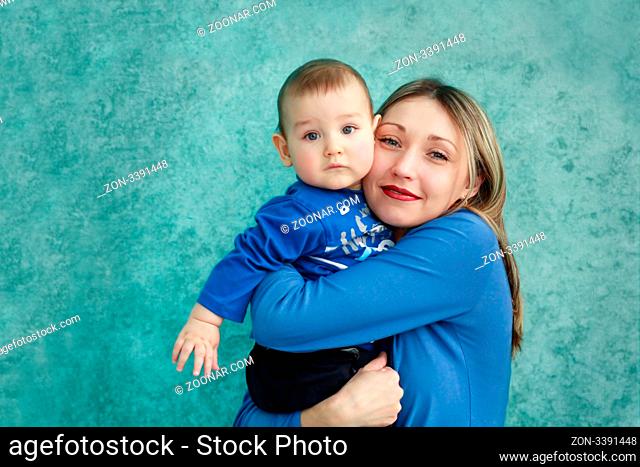 Mother keeps son in his hands