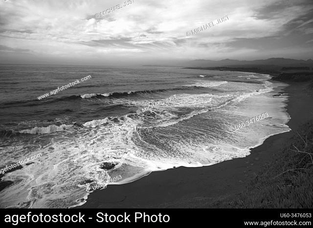 Waves crash along the coastline near San Simeon, California