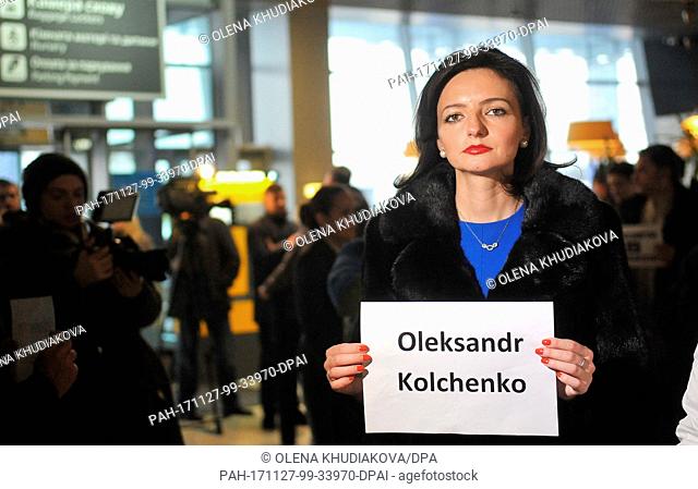 November 26, 2017 - Kyiv, Ukraine - Spokesperson of the Ukrainian Foreign Ministry Mariana Betsa holds a card bearing the name of Crimean activist Oleksandr...