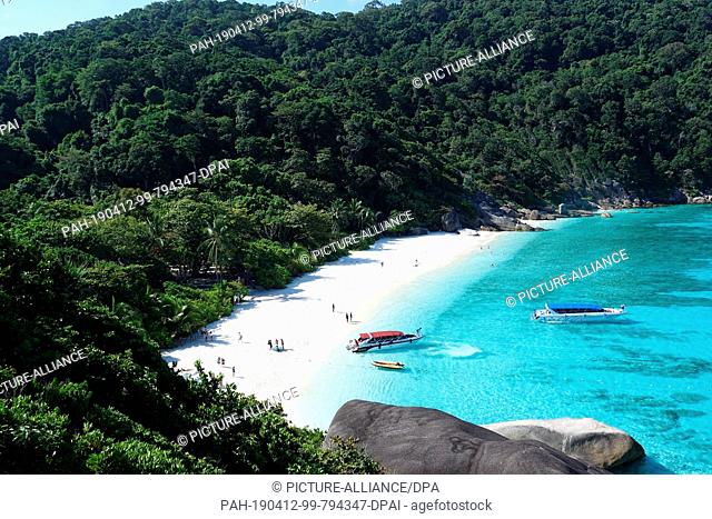 08 March 2019, Thailand, Similan: Speedboats lie in the crystal clear waters of the ""Ao Kuerk"" bay on the island of Ko Similan