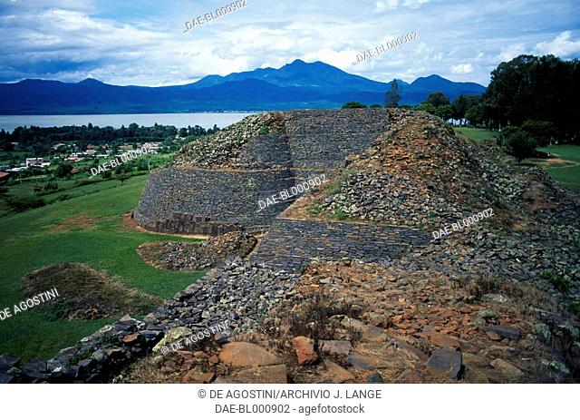 View of yacata pyramids with Lake Patzcuaro in the background, ruins in the ceremonial centre of Tzintzuntzan, Michoacan, Mexico