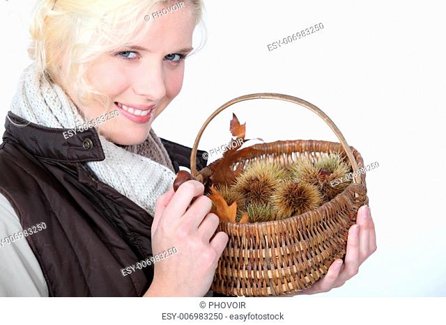 Woman with basket of chestnuts