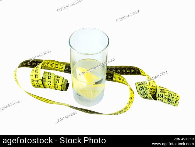 spring water with lemon and a glass of yellow centimeter around the glass isolated on white background