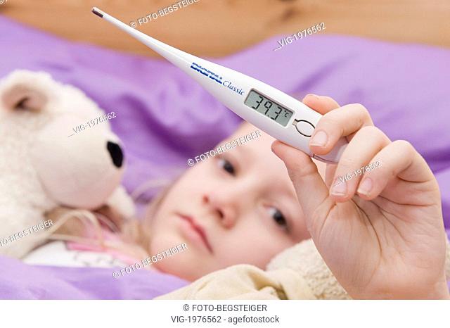 , 09.02.2010, sick girl with clinical thermometer in bed - 09/02/2010