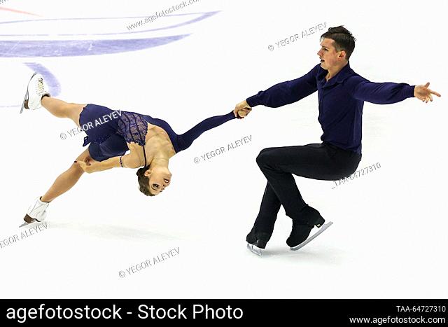 RUSSIA, KAZAN - NOVEMBER 12, 2023: Anastasia Mishina and Alexander Gallyamov perform a death spiral during the pairs' free skating event at Stage 4 of the...