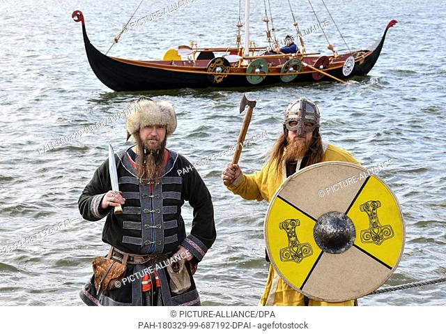 29 March 2018, Germany, Hohenfelden: The first of three Viking ships being set afloat for the first time on the Stausee lake for the medieval festival ""The...