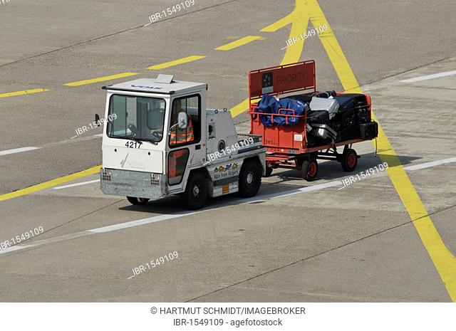 Transporting the luggage to the terminal, vehicle with trailer, Cologne-Bonn Airport, North Rhine-Westphalia, Germany, Europe