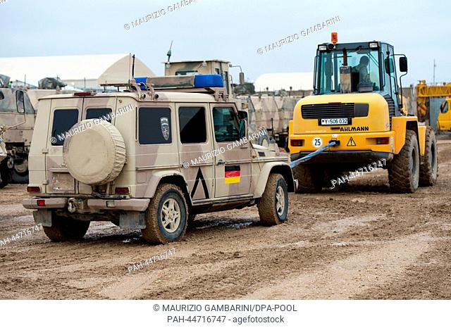 A type Wolf armoured vehichle is towed into the material air lock in Mazar-i-Sharif, Afghanistan, 11 December 2013. The vehichle will be brought back to German...