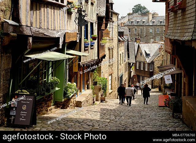 Old town alley with half-timbered houses in Dinan, Departement Cotes d'Armor, Brittany, France