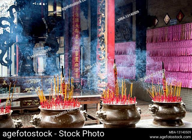 the smoke of incense sticks carries the prayers to heaven, Vietnam