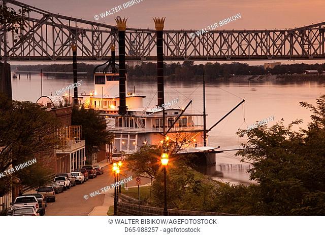 USA, Mississippi, Natchez, Natchez Under the Hill, former red-light area, with Isle of Capri Casino riverboat, dusk