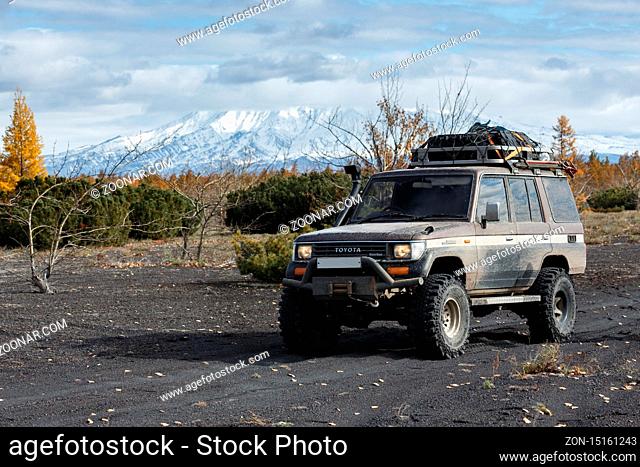 KAMCHATKA PENINSULA, RUSSIAN FAR EAST - OCTOBER 2, 2016: Japanese 4x4 automobile Toyota Land Cruiser Prado prepared for off-road tourism and long travel through...