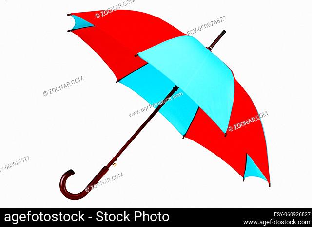 An inclined umbrella on white background with clipping path
