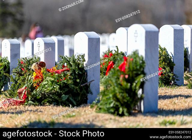 Veterans cemetery adorned with wreaths for the holiday season