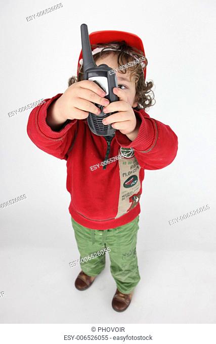 Little boy holding radio-receiver