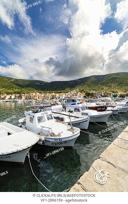 View of Komiza village and its port (Komiza, Vis, Vis Island, Split-Dalmatia county, Dalmatia region, Croatia, Europe)