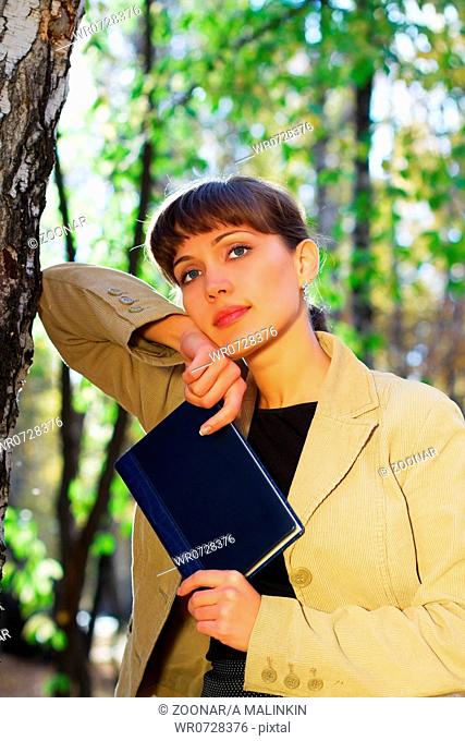 Young businesswoman with a book