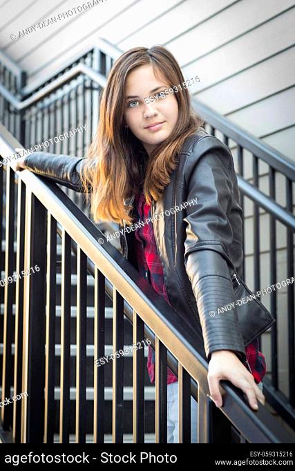 Portrait of Pretty Young Girl Wearing Leather Jacket on Staircase