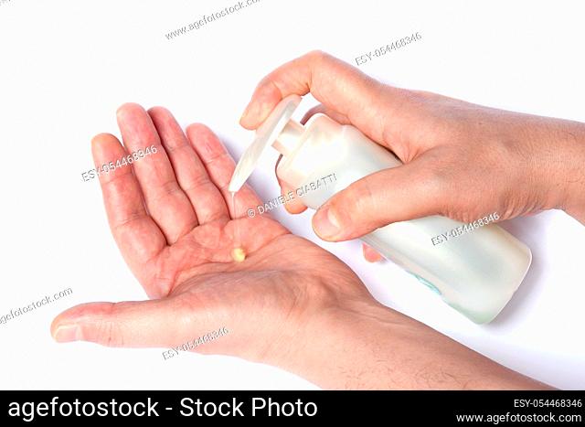 man washes his hands with soap to protect himself from the corona virus (COVIT-19) and bacteria, washing his hands with soap on a white background