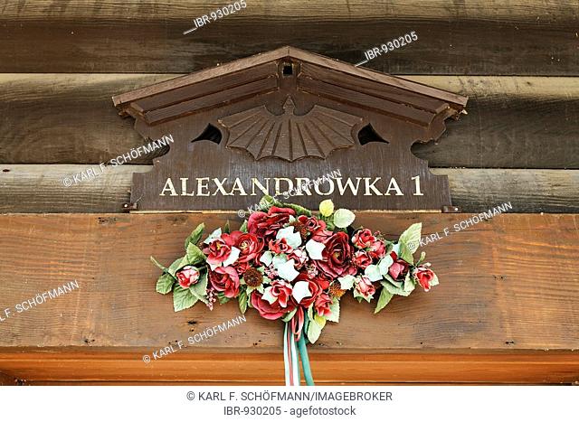 Carved house sign Alexandrowka 1, decorated with fake flowers, detail, Russian colony, Alexandrowka, Potsdam, Brandenburg, Germany, Europe
