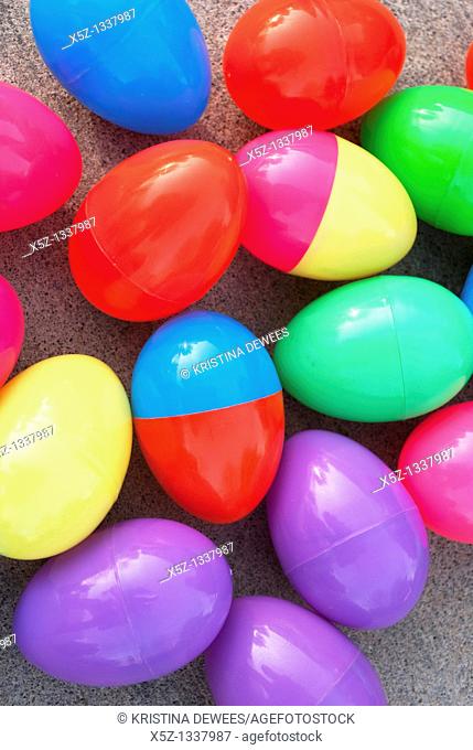 An assortment of brightly colored plastic Easter eggs