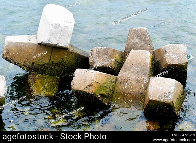 Photo of concrete breakers at the seaside