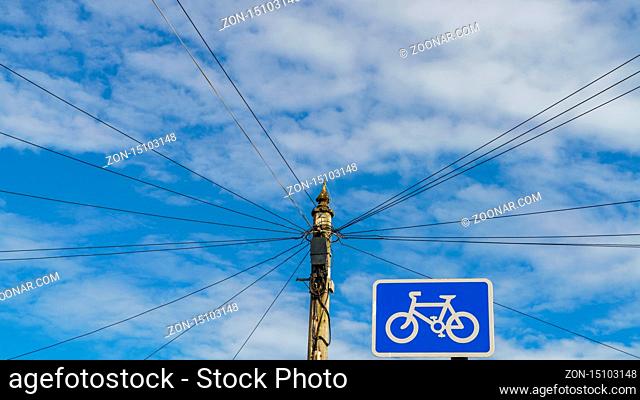 Power cables and power pole with bycicle sign, Exmouth, Devon, England, UK