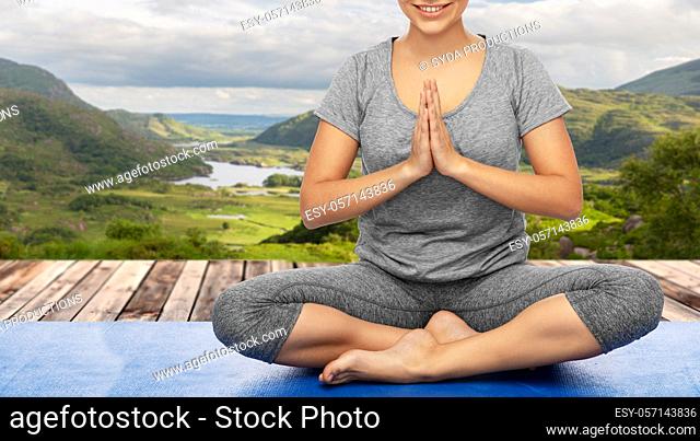 woman doing yoga over Killarney National Park
