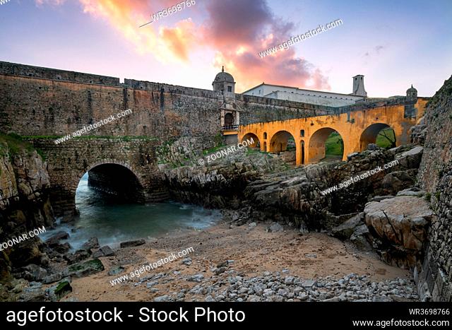Peniche Fortress with beautiful historic bridge at sunset, in Portugal