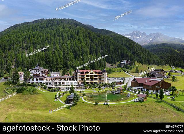Aerial view Post Hotel with pond, on the right main school and local history museum, mountain village Sulden, Solda, district of the municipality Stilfs