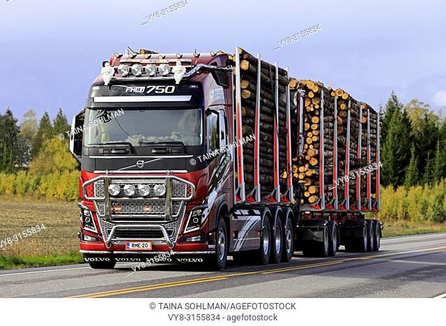 Salo, Finland. September 28, 2018: Customized Volvo FH16 750 logging truck of R. M. Enberg Transport Ab hauls a log load along highway in autumn