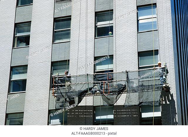 Window cleaning scaffold on side of building