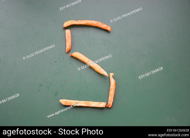 Letters of the english alphabet laid out from french the fries