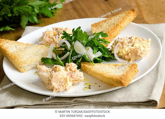 Crab mayonnaise with toasts and herb salad