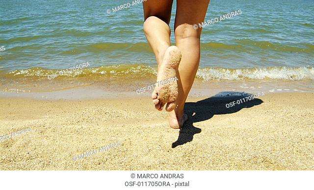one woman running into the sea