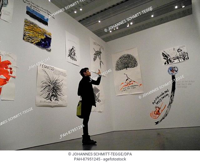 A visitor looks at artworks of the exhibition 'A Pen Of All Work' by Raymond Pettibon at the New Museum in New York, USA, 07 February 2017