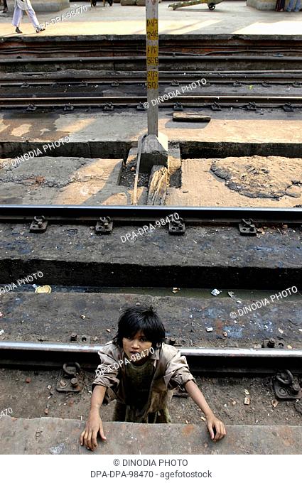 Indian Street children Who Live And Work at Howrah Railway platform , Calcutta , West Bengal , India