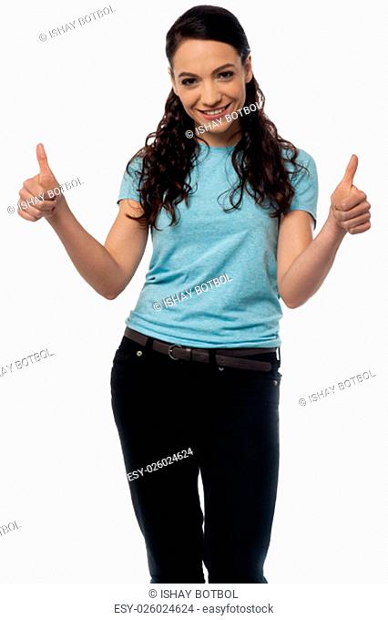 Portrait of a smiling woman with thumbs up gesture