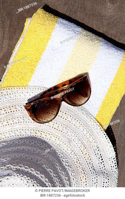 Beach towel, sunglasses, sun hat, summer vacation