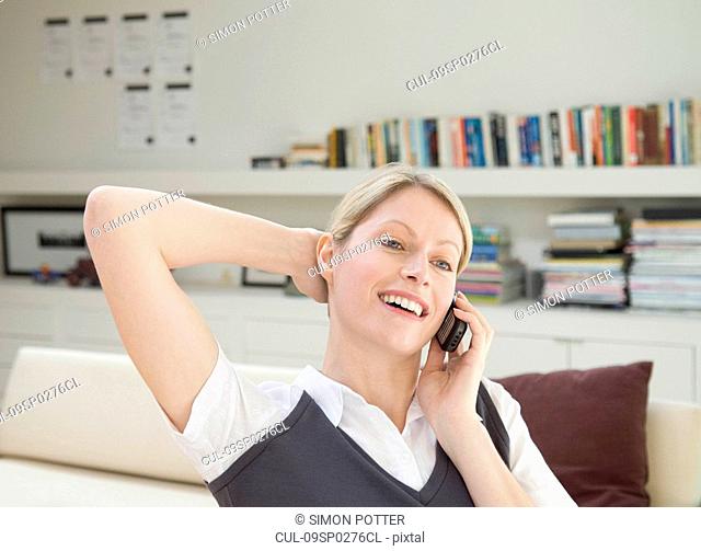 A female business woman on the phone