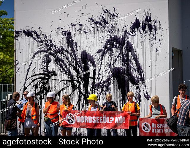 22 June 2022, Berlin: Activists of the group ""Last Generation"" sprayed an oil-like liquid on the facade at the Chancellery to protest against the search for...