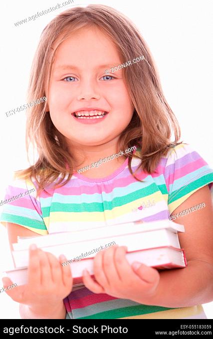 Cute and happy girl holding books ove white background