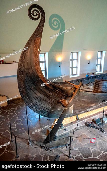 Oslo, Ostlandet / Norway - 2019/08/31: Oseberg ship excavated from ship burial archeological site, exhibited in Viking Ship Museum on Bygdoy peninsula of Oslo